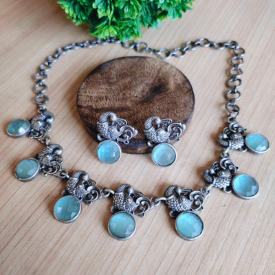 Peacock-inspired Oxidized Silver Necklace Set Adorned with Stunning Stones