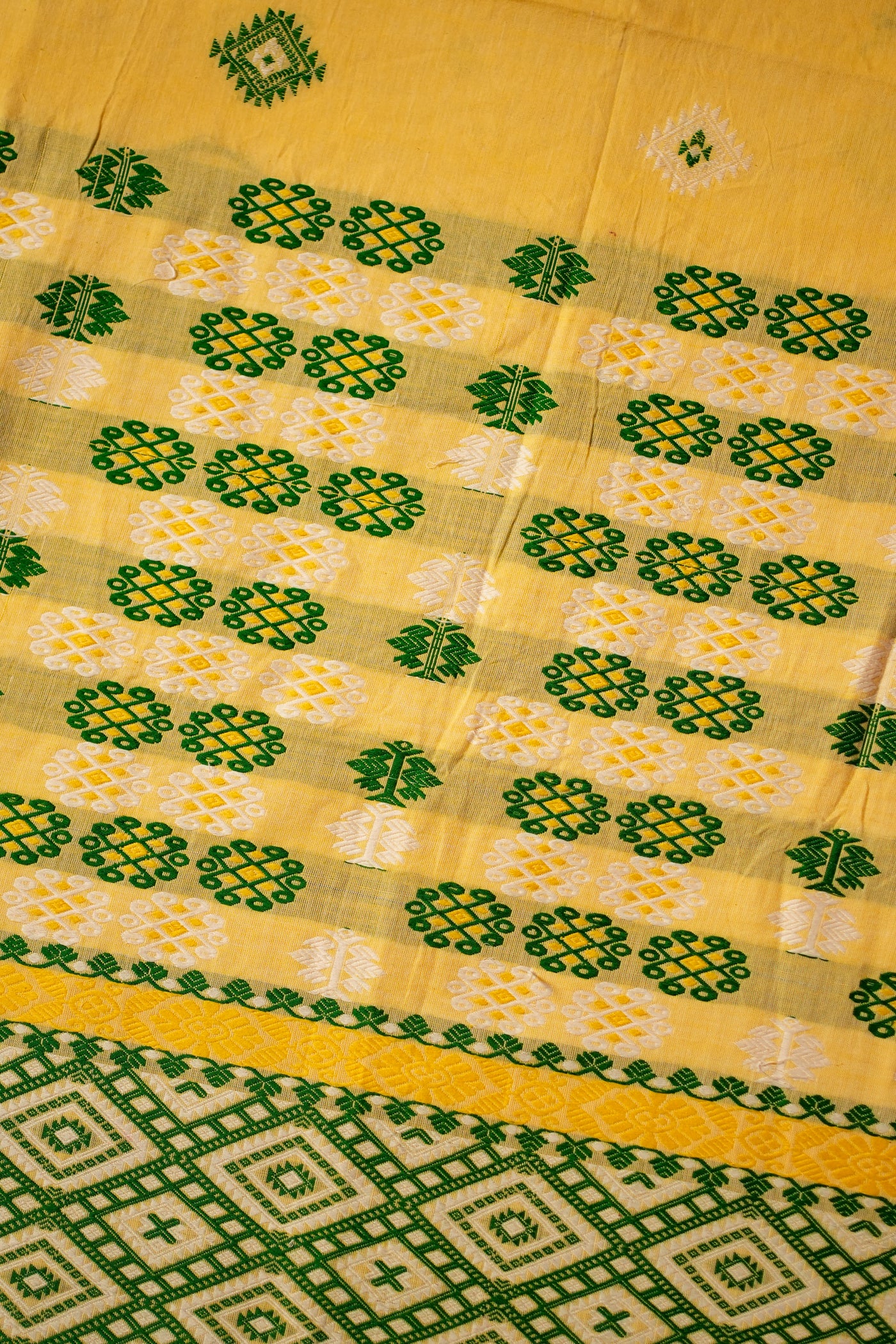 Bright Yellow Assam Cotton Handloom Saree – Mishing Tribe Weave with Traditional Seven Sisters (Saat Bhoni) Design