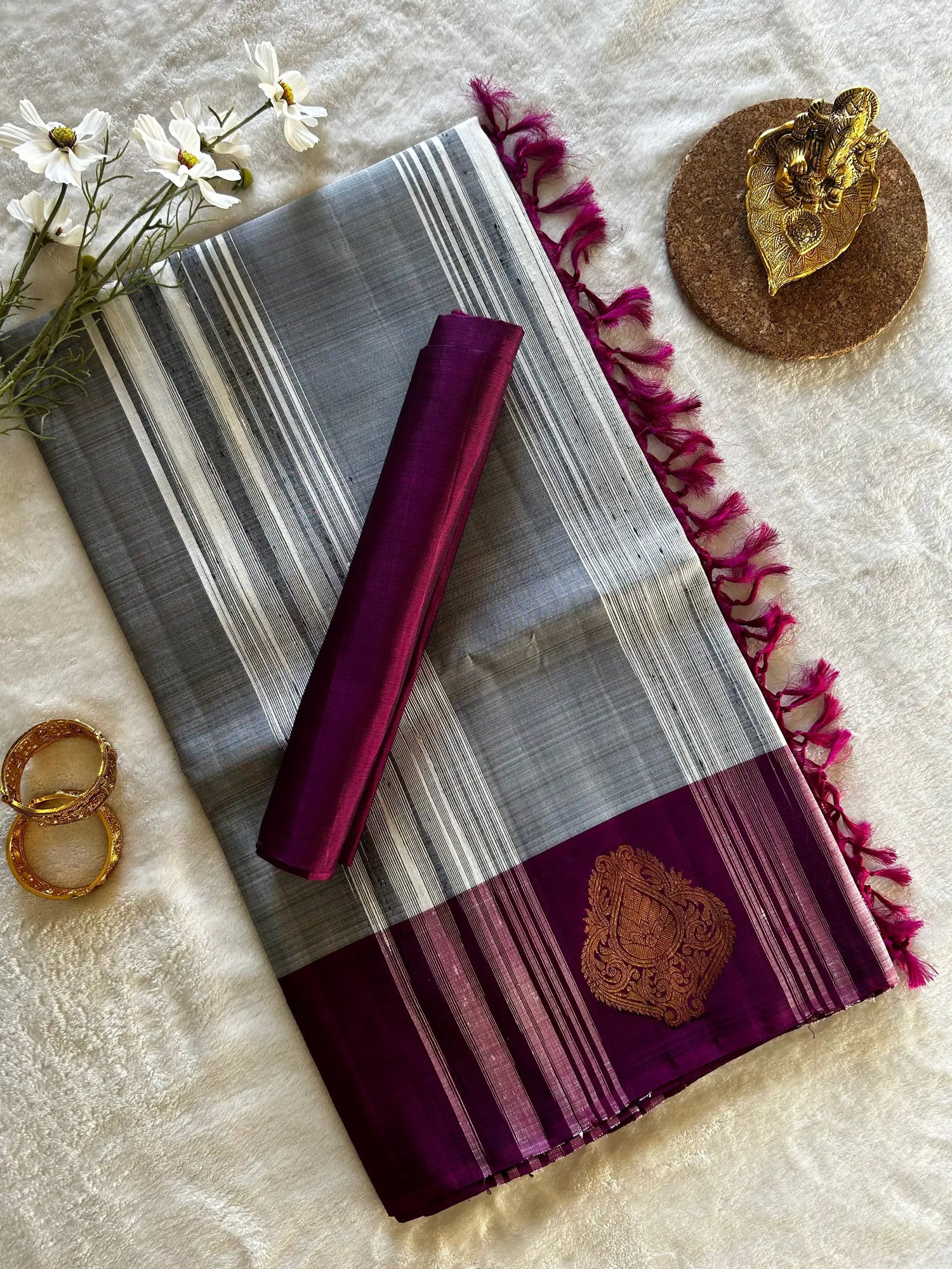 Sari: Pure Handloom Kanchipuram Khadi Silk in silver grey with purple border and gold zari motifs